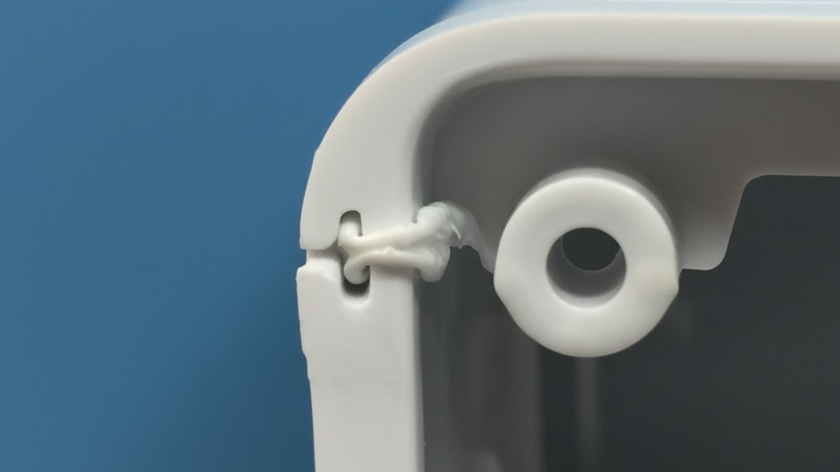 Side view of a welded plastic part with a flash trap