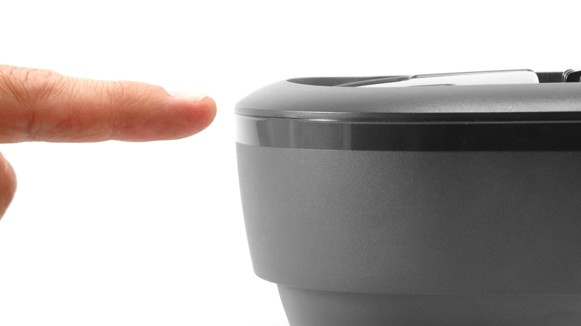 Finger pointing at a clean, welded plastic part